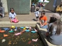 other children enjoyed setting their boats afloat in the fountain